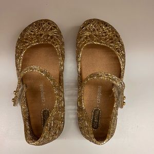 Mini Melissa girl gold shoes.